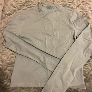 Light blue stretchy turtle neck.